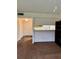 Spacious living room with carpet, and open view into the kitchen area at 6324 Newtown Cir # 24B2, Tampa, FL 33615