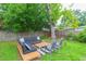 Inviting backyard seating area with stylish sectional couch and chairs, perfect for outdoor relaxation at 6412 S Richard Ave, Tampa, FL 33616