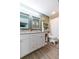 Bright bathroom featuring a double vanity with modern fixtures and a combined shower and tub at 6412 S Richard Ave, Tampa, FL 33616