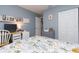 Comfortable bedroom featuring a dedicated desk space, shelving, and neutral color scheme at 6412 S Richard Ave, Tampa, FL 33616