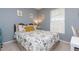Cozy bedroom with a double bed, soft pillows, and sunny window for natural light at 6412 S Richard Ave, Tampa, FL 33616