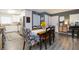 Dining area featuring stylish floral-patterned chairs and seamlessly connected to the kitchen at 6412 S Richard Ave, Tampa, FL 33616