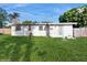 The backyard features a well maintained lawn at 6901 10Th N St, St Petersburg, FL 33702