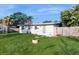 The backyard features a well maintained lawn and wood fence at 6901 10Th N St, St Petersburg, FL 33702