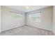 Bedroom featuring carpet flooring, natural light, and fresh paint throughout at 6901 10Th N St, St Petersburg, FL 33702
