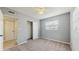 Cozy bedroom with carpet flooring, closet, and natural light from a window at 6901 10Th N St, St Petersburg, FL 33702