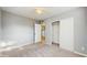 Bedroom featuring carpet flooring, closet, and neutral paint at 6901 10Th N St, St Petersburg, FL 33702