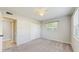Bedroom with carpet floors, closet and natural light from a window at 6901 10Th N St, St Petersburg, FL 33702