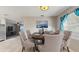 Elegant dining room featuring a table set with six chairs at 6901 10Th N St, St Petersburg, FL 33702