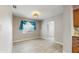 Open dining area featuring plank flooring and bright blue window treatments at 6901 10Th N St, St Petersburg, FL 33702