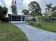 Charming single story home with driveway and tropical landscaping at 6901 10Th N St, St Petersburg, FL 33702