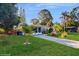Charming single-story home featuring a well-manicured lawn and a paved driveway at 6901 10Th N St, St Petersburg, FL 33702
