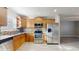 Modern kitchen features stainless steel appliances, tile backsplash, and wood-look flooring at 6901 10Th N St, St Petersburg, FL 33702