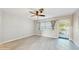 Open living room with plank flooring and a ceiling fan at 6901 10Th N St, St Petersburg, FL 33702