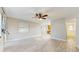 Large open room with light plank flooring, leading to other rooms at 6901 10Th N St, St Petersburg, FL 33702