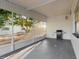 An enclosed porch area with a grill and view of the backyard at 6901 10Th N St, St Petersburg, FL 33702