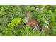Aerial view of the home showing mature trees and landscaping at 6901 Arbor Oaks Ct, Bradenton, FL 34209