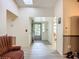 Bright foyer with tile flooring, offering a welcoming space upon entering the home at 6901 Arbor Oaks Ct, Bradenton, FL 34209