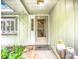 Cozy front porch with decorative touches, creating a welcoming entrance to the home at 6901 Arbor Oaks Ct, Bradenton, FL 34209