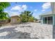 The backyard has a well-maintained patio and a charming shed, perfect for storage or a hobby space at 716 Laurel Ave, Venice, FL 34285