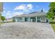A spacious backyard boasts an expansive patio, providing ample room for outdoor activities and relaxation at 716 Laurel Ave, Venice, FL 34285