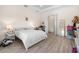 Bright bedroom with tray ceiling and hard wood floors at 716 Laurel Ave, Venice, FL 34285