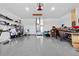 Spacious garage with epoxy flooring, a garage door opener and ample storage space for vehicles and equipment at 716 Laurel Ave, Venice, FL 34285