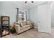 Cozy living room features wood-look floors, neutral walls, and a sofa creating a comfortable and inviting space at 716 Laurel Ave, Venice, FL 34285
