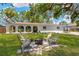 Expansive backyard offers a fire pit, perfect for outdoor gatherings and relaxation at 7210 S Sparkman St, Tampa, FL 33616