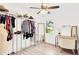 Walk-in closet offering ample storage with clothing racks, shelving, and a vanity area at 7210 S Sparkman St, Tampa, FL 33616