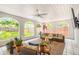 Inviting covered patio with ample seating, stylish decor, and an open view of the backyard at 7210 S Sparkman St, Tampa, FL 33616