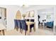 Elegant dining area with seating for six, modern decor, and an open layout at 7210 S Sparkman St, Tampa, FL 33616