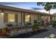 Charming front porch with a cozy seating area and beautiful landscaping, perfect for relaxing outdoors at 7210 S Sparkman St, Tampa, FL 33616