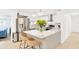Modern kitchen featuring stainless steel appliances, quartz countertops, and a breakfast bar at 7210 S Sparkman St, Tampa, FL 33616