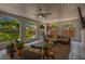 Covered lanai with comfortable seating and views of the landscaped backyard, ideal for relaxation at 7210 S Sparkman St, Tampa, FL 33616
