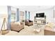Bright living room featuring cozy armchairs, neutral tones, and plenty of natural light at 7210 S Sparkman St, Tampa, FL 33616