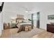 Bright bedroom with soft rug, bedside tables, and decorative lamps at 7210 S Sparkman St, Tampa, FL 33616