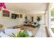 Inviting covered patio with a ceiling fan and a comfortable seating area at 7210 S Sparkman St, Tampa, FL 33616