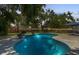 Beautiful backyard pool with a patio area, perfect for relaxation and outdoor entertaining at 7210 S Sparkman St, Tampa, FL 33616