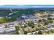 Scenic aerial view showcasing the neighborhood, nearby shops, restaurants and natural green space at 8339 75Th Ave, Seminole, FL 33777