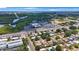 Scenic aerial view showcasing the neighborhood, nearby shops, restaurants and natural green space at 8339 75Th Ave, Seminole, FL 33777