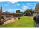 Backyard featuring a fire pit with chairs, a play set, and a lush green lawn at 8339 75Th Ave, Seminole, FL 33777