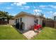 Backyard with patio, grill, dining table, and lush green lawn at 8339 75Th Ave, Seminole, FL 33777