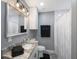 Updated bathroom featuring modern vanity, decorative mirror and bathtub with shower at 8339 75Th Ave, Seminole, FL 33777
