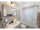 Bathroom features a modern sink, vanity, and shower with patterned curtain at 8339 75Th Ave, Seminole, FL 33777