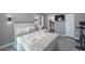 Well-lit bedroom with decoratively patterned bedding and easy access to the in-suite bathroom at 8339 75Th Ave, Seminole, FL 33777