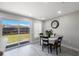 Bright dining area with sliding glass doors to backyard and modern decor at 8339 75Th Ave, Seminole, FL 33777