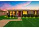 Charming home featuring a manicured lawn and beautiful landscaping with a red door entrance at 8339 75Th Ave, Seminole, FL 33777