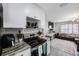 Modern kitchen with sleek appliances, stylish countertops, and an adjacent living area at 8339 75Th Ave, Seminole, FL 33777