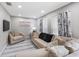 Comfortable living room features a sectional sofa, accent chair, and decorative curtains at 8339 75Th Ave, Seminole, FL 33777